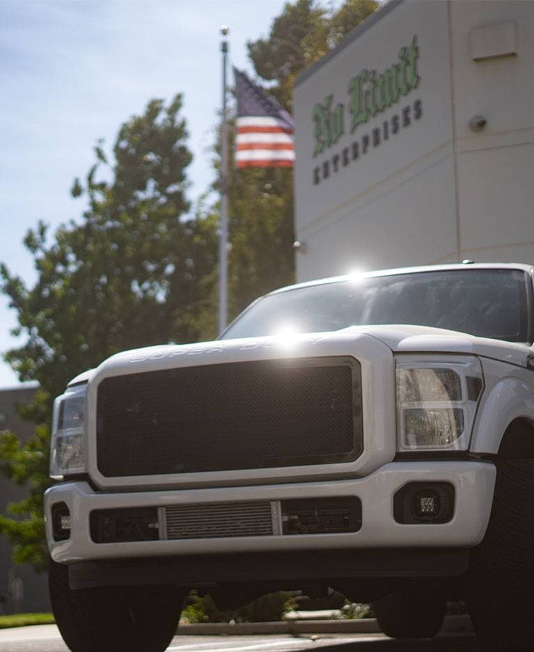 Lifted Ford Super Duty in front of the No Limit Fabrication shop in Moorpark, California
