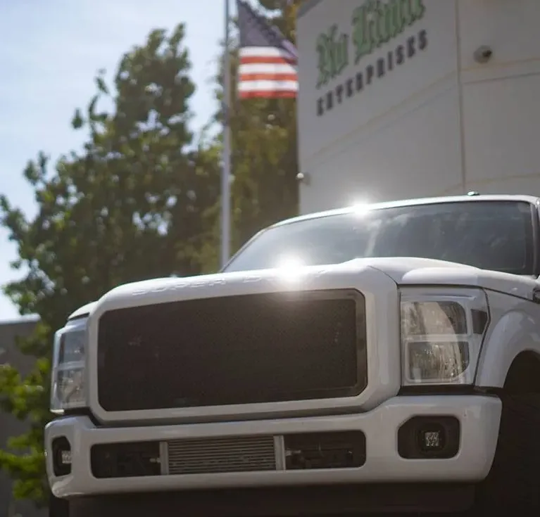 Lifted Ford Super Duty in front of the No Limit Fabrication shop in Moorpark, California
